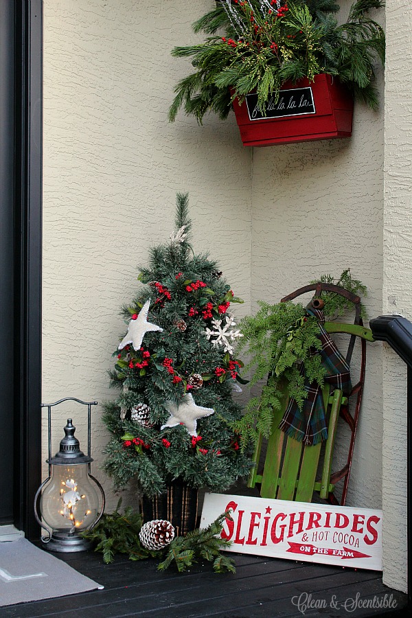 Porch full of Christmas garlands & signages